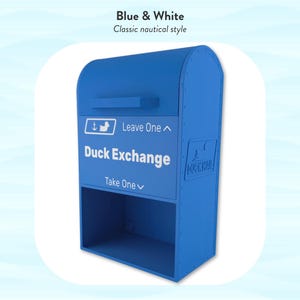 May include: A blue and white Duck Exchange mailbox with the text "Duck Exchange" and "Leave One" and "Take One". The mailbox has a classic nautical style.