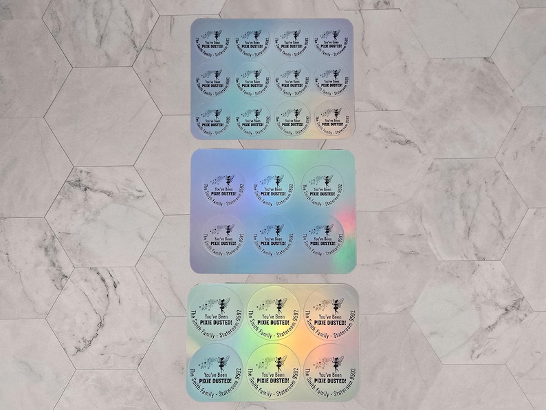 Puede incluir: Una hoja de 18 pegatinas hologr&aacute;ficas iridiscentes con un dise&ntilde;o de hada y el texto "You've Been Pixie Dusted - The Smith Family - Staten Island, NY 2023".