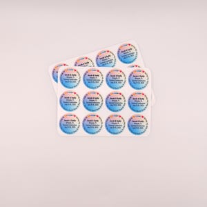 May include: Two sheets of round stickers with a gradient blue and pink background. Each sticker has text that reads "Jacob & Emily, Orlando, FL, Carnival Celebration, July 25, 2020, A Soul & Body Keep in Tune!"