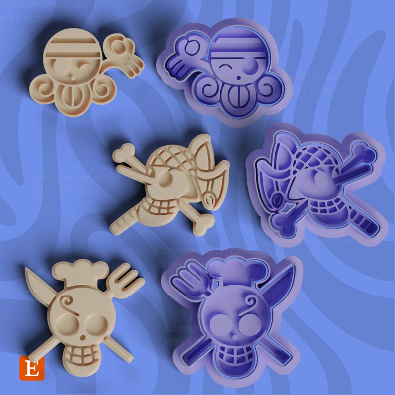 Op de afbeelding: Zes verschillende koekjesvormen, elk met een ander personage uit de populaire anime-serie One Piece. De vormen zijn gemaakt van lichtbeige plastic en zijn gevormd als de hoofden van de personages. De personages zijn Monkey D. Luffy, Roronoa Zoro, Sanji, Nami, Usopp en Chopper.