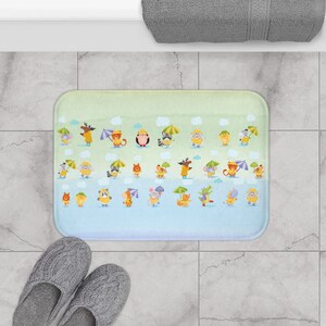 May include: A light blue and green bath mat with a colourful pattern of animals holding umbrellas. The animals include a bear, a raccoon, a fox, a moose, a giraffe, a cat, a dog, and an elephant.