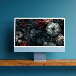 A set of dark, moody floral desktop wallpapers featuring richly detailed blossoms in deep, dramatic tones. The collection includes close-up compositions of roses, anemones, and layered petals in shades of crimson, blush pink, ivory, and cool blue, set against shadowy foliage. Soft lighting and subtle highlights create a cinematic, almost velvety texture, with hints of mist and glow adding depth and atmosphere.