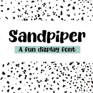 May include: A white background with a pattern of black and brown speckles. The word "Sandpiper" is written in large, bold, black letters. Below it, a light blue rectangle contains the text "A fun display font."