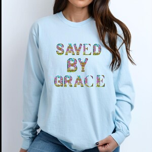 Saved by Grace, stained glass. Comfort colors shirts. Sweatshirts, T-shirts, and long-sleeved