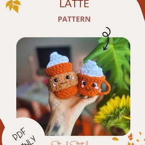 May include: A crochet pattern for a pumpkin spice latte, featuring two adorable crocheted latte cups with smiling faces and whipped cream. The pattern is available as a PDF download and is perfect for autumn crafting.