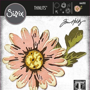 May include: A die-cut set of 7 flower and leaf designs for crafting. The set includes a large pink flower with a yellow center and a green leaf. The die-cut set is from Sizzix and designed by Jin-Holtz. The product number is 666283.