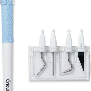 May include: A Cricut craft tool set featuring a light blue and white handle with a clear cap, and four different weeding tools in a clear plastic case. The tools have silver metal tips and white handles.