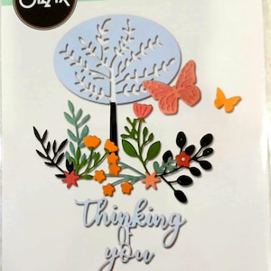 May include: A set of three ceramic mugs with a speckled, matte finish. The mugs are in shades of cream, light gray, and dark gray. Each mug has a simple, minimalist design and a rounded handle.