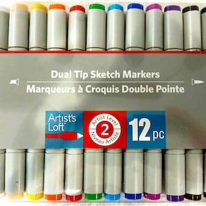 May include: A set of 12 dual-tip sketch markers in a variety of colors. The markers are gray with colored tips and caps. The packaging includes the text "Dual Tip Sketch Markers" and "Artist's Loft".