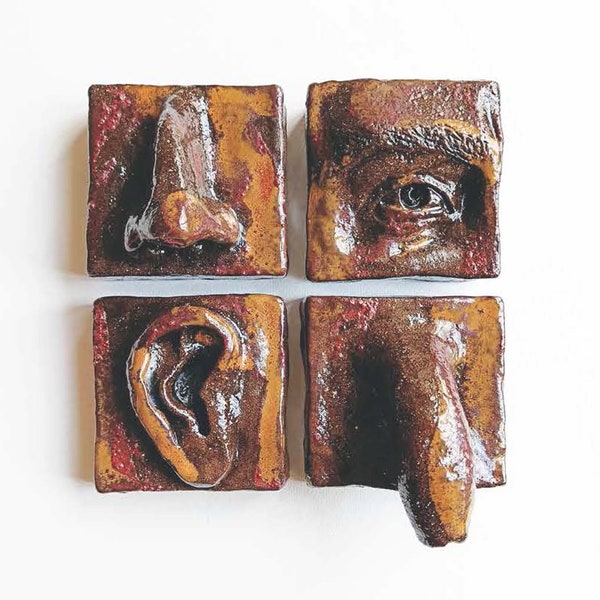 Escultura colgante de pared de nariz de cerámica disparando raku