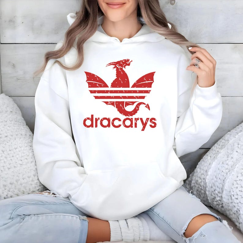 May include: White hoodie with a red dragon logo and the text "dracarys" printed on the front.