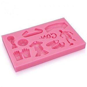 May include: Pink silicone mould with 10 different shapes for making edible decorations. The shapes include a football, jersey, trophy, boots, and gloves.