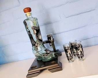 Cowboy boot bottle with 4-shot collectible glass shot glasses, hand-blown and on a wooden base.