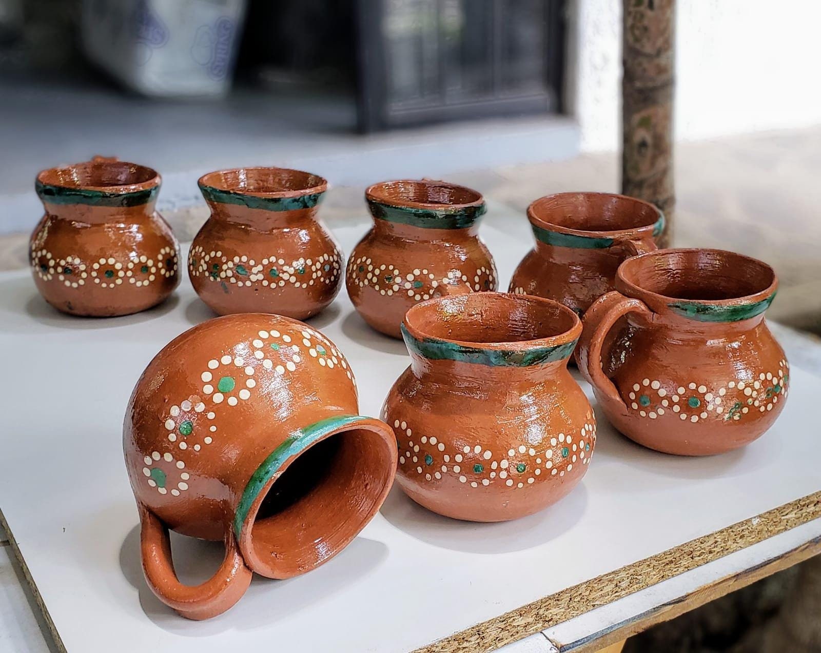 Set of traditional Mexican clay cups, coffee, champurrado, pot coffee,