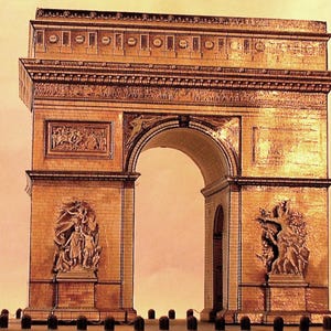 May include: A detailed model of the Arc de Triomphe, a famous monument in Paris. The model is made of a light brown material, with intricate carvings and sculptures. The archway is the focal point, with detailed relief sculptures on the sides.