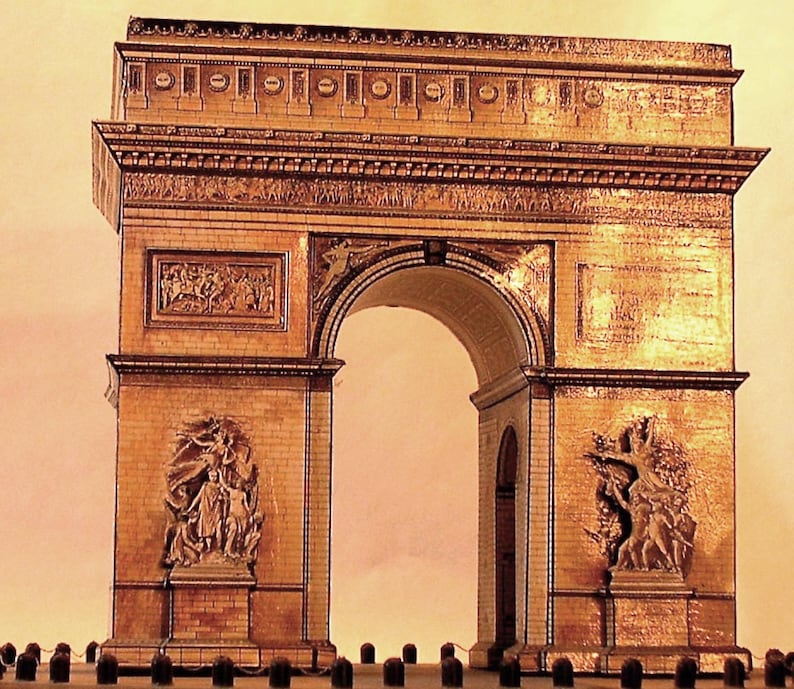 May include: A detailed model of the Arc de Triomphe, a famous monument in Paris. The model is made of a light brown material, with intricate carvings and sculptures. The archway is the focal point, with detailed relief sculptures on the sides.