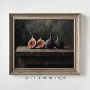 May include: A framed painting depicting a still life with four figs on a wooden table. Two of the figs are cut in half, showing their pink flesh. The background is a dark, textured wall.