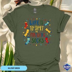 May include: A green t-shirt with a colorful graphic that says "Life is too short for matching socks".