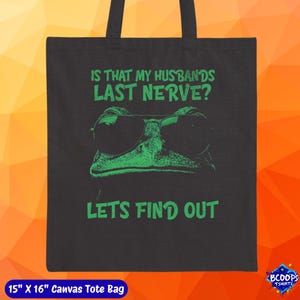 A bold green frog in sunglasses with the phrase “Is That My Husband’s Last Nerve? Let’s Find Out.” Printed large and centered on a canvas tote bag, this design brings playful humor to everyday use—great for gifting, groceries, beach gear, or daily essentials.