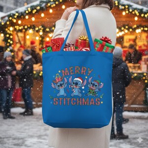 May include: A blue tote bag featuring the text "MERRY STITCHMAS" and cartoon characters dressed for Christmas. The bag is filled with wrapped gifts. The background shows a snowy outdoor scene with Christmas lights.