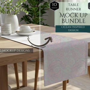 May include: A wooden table is set with a white table runner and a patterned runner. The text on the image reads "TABLE RUNNER MOCK UP BUNDLE OCEAN INSPIRED DESIGN" and "10 HQ MOCKUP DESIGNS". A vase with flowers and a cup and saucer are on the table.