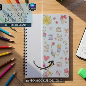 May include: Spiral notebook mock-up bundle with youth designs. The notebook is open, displaying a blank page and a page with colorful illustrations of flowers, hearts, and teddy bears. Colored pencils and a ruler are scattered around.