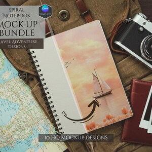 May include: A spiral bound notebook mockup with a travel theme. The notebook has a watercolor design of a sailboat on a sunset background. The notebook is lying on a brown canvas bag with a map, a camera, and a wallet.