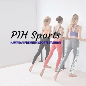May include: Three women wearing different colored leggings and sports bras are standing in a studio, holding onto a barre. The text "PIH Sports" and "HAWAIIAN PREMIUM SPORTS FASHION" is displayed on the wall behind them.