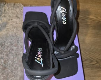 Black strap heels. New in box