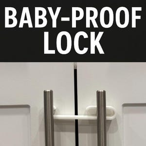 May include: White cabinet doors with silver handles secured by a white baby-proof lock. The text "BABY-PROOF LOCK" is displayed in large, bold, white letters against a black background above the cabinet doors.
