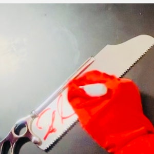 Stainless Steel Bone Saw signed by Robin Atkin Downes Medic From Team Fortress 2 image 6