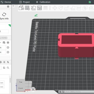 May include: A red rectangular 3D model is shown on a computer screen, part of a 3D printing project. The software interface includes printer settings, filament selection, and quality adjustments. The model is on a textured plate, with measurements in mm.
