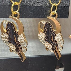 enamel raven with moon and white flowers