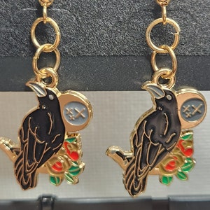 enamel raven with moon and flowers