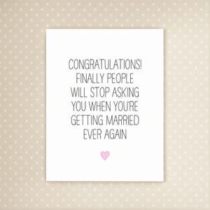 May include: A white card with black text reading "CONGRATULATIONS! FINALLY PEOPLE WILL STOP ASKING YOU WHEN YOU'RE GETTING MARRIED EVER AGAIN". A small pink heart is at the bottom. The background is a light beige with small white polka dots.