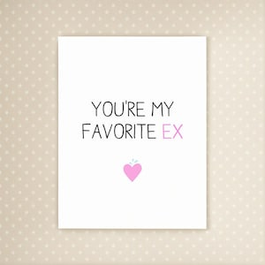 May include: A white greeting card with the text "YOU'RE MY FAVORITE EX" in black and pink. A pink heart with a small blue splash is at the bottom. The card is on a dotted background.