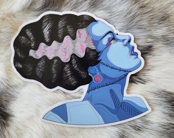 May include: A blue and pink illustration of a Frankenstein's monster with stitched seams and a lightning bolt earring. The monster has black hair and is looking up.