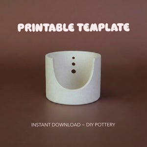 May include: A light-coloured, cylindrical pottery template with a curved opening and three small holes. The text "PRINTABLE TEMPLATE" is above the pottery, and "INSTANT DOWNLOAD ~ DIY POTTERY" is below.