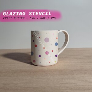 May include: White ceramic mug with a colorful polka dot pattern. The dots are red, blue, purple, yellow, and pink. The mug has a handle and the text "@cutclaylovetemplates" is on the side.