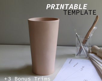 May include: Printable vase template with a pink vase and three bonus trims. The template includes instructions for cutting and assembling the vase.