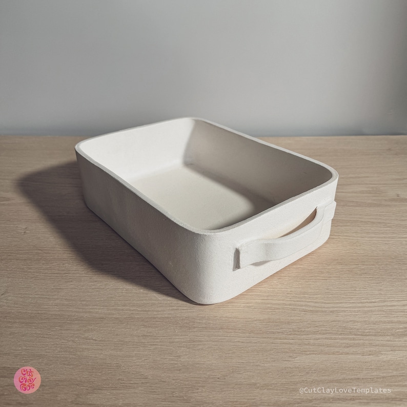 May include: A rectangular off-white baking dish with rounded corners and two side handles. The surface has a matte, textured finish. The text CutClayLoveTemplates is visible in the bottom right corner, and a circular logo is in the bottom left.