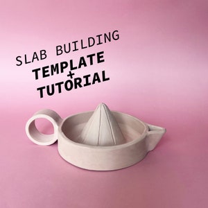 May include: A light beige ceramic citrus juicer with a handle and a cone-shaped reamer. The text "SLAB BUILDING TEMPLATE + TUTORIAL" is written in black above the juicer.