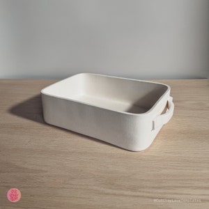 May include: A rectangular off-white baking dish with rounded corners and two side handles. The exterior and interior surfaces have a matte, textured finish. The text @CutClayLoveTemplates is visible in the bottom right corner of the image.