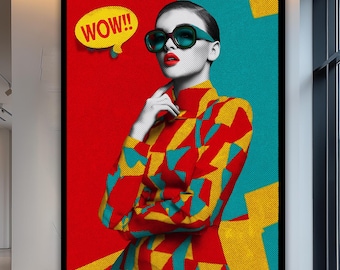 May include: A large framed pop art print featuring a woman wearing sunglasses and a patterned outfit. The background is split red and teal, with a yellow speech bubble that says "WOW!!". The artwork is displayed in a modern art gallery.