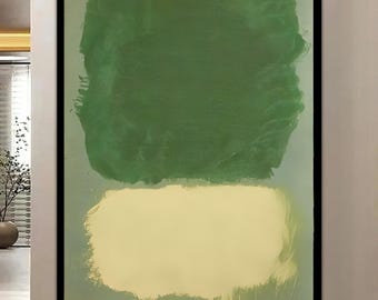 May include: A rectangular wall art piece featuring a large, textured dark green block of paint positioned above a smaller, lighter cream-colored block, both set against a muted sage green background and enclosed in a thin black frame.