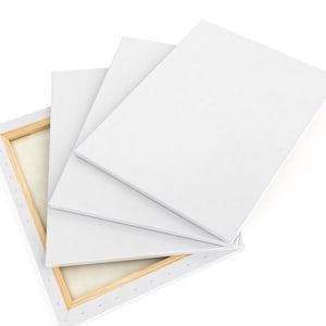 a stack of white canvas boards or sheets, with one of them partially open, revealing a wooden frame.