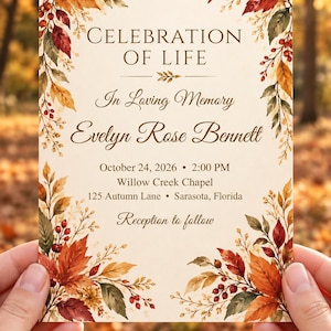 May include: A rectangular Celebration of Life memorial card featuring a cream background with watercolor autumn leaves and red berries in the corners. The text reads: Celebration of Life, In Loving Memory, Evelyn Rose Bennett, October 24, 2026, 2:00 PM, Willow Creek Chapel, 125 Autumn Lane, Sarasota, Florida, Reception to follow.