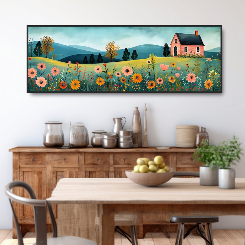 May include: A long, horizontal painting of a pink house with a white roof and a green lawn. The house is surrounded by a field of colorful flowers, including yellow, orange, pink, and red. The background is a blue sky with white clouds and green hills.