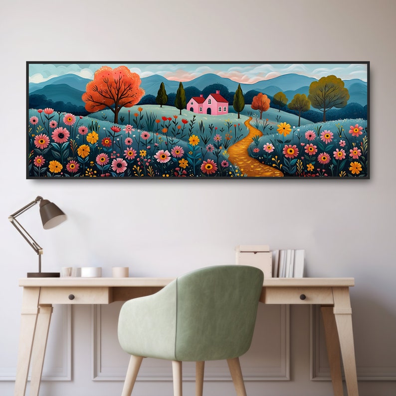 May include: A framed illustration of a pink house with a yellow path leading to it, surrounded by colorful flowers and green trees against a blue mountain backdrop.