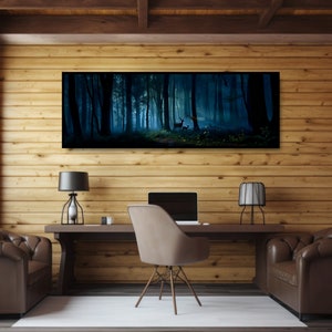 May include: A long, rectangular canvas print depicting a dark, misty forest scene with deer. The artwork hangs above a wooden desk with a laptop, two lamps, and a chair. The room has wood paneling and two leather armchairs.